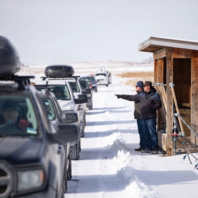 Snowy day with parked vehicles at roadside