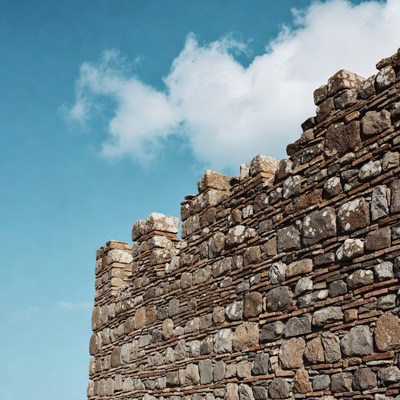 Ancient stone wall under blue sky