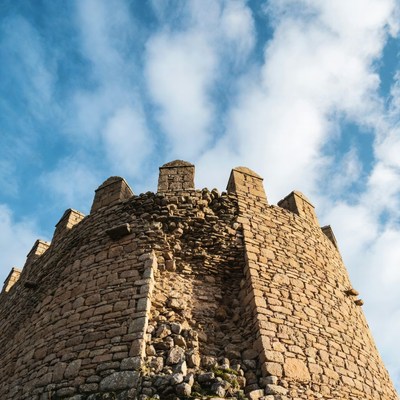 Historic stone tower under blue sky