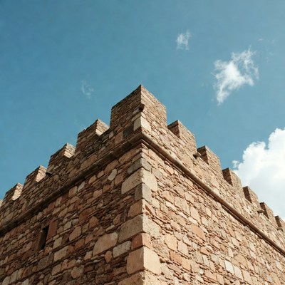 Historic stone castle under blue sky