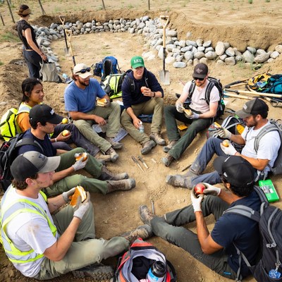 Team breaks for lunch on excavation site