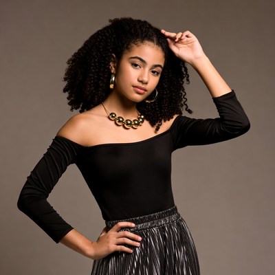 Young girl poses with confidence in studio