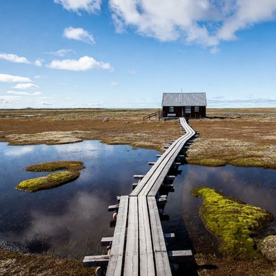 House on the path by water
