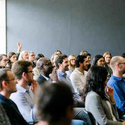 People engage in discussion at conference