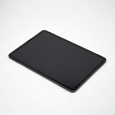 Black tablet on white surface