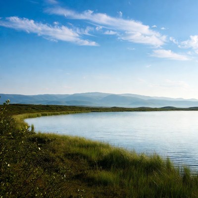 Scenic view of a calm lake with hills
