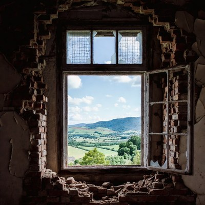 View through broken window in abandoned building