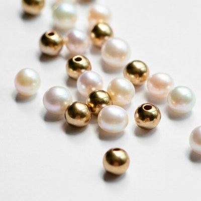 Pearls and beads on a white surface