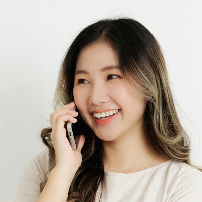 Smiling woman talking on phone