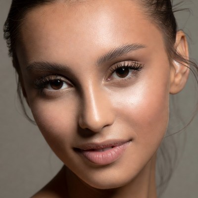 Woman with natural makeup looks at camera