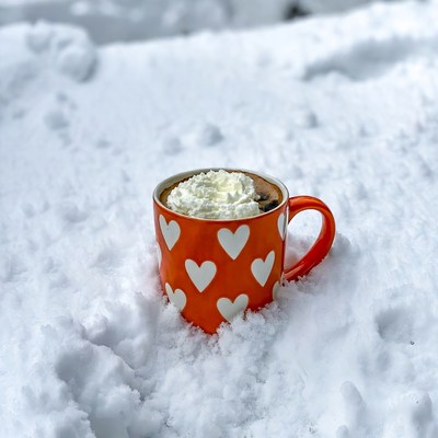 Hot drink in snowy setting