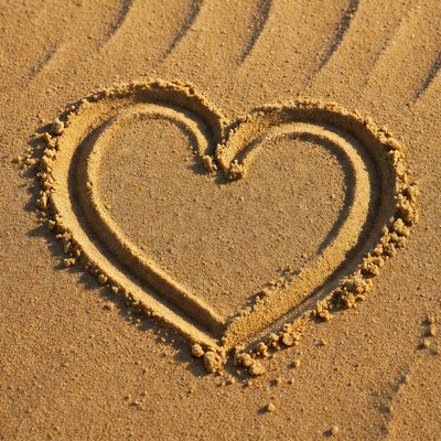 Heart shape drawn in sand