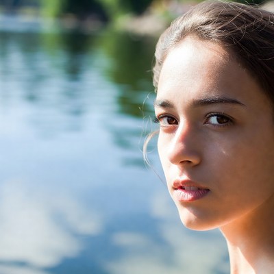 Young woman near calm water