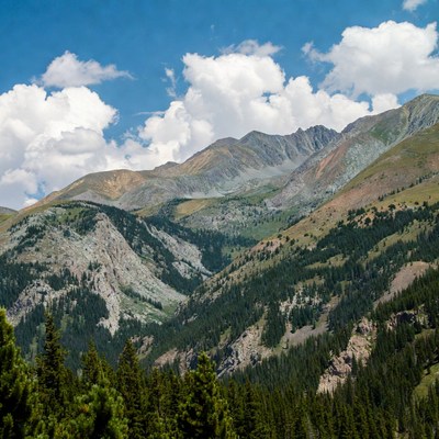 Mountain landscape with clouds and trees