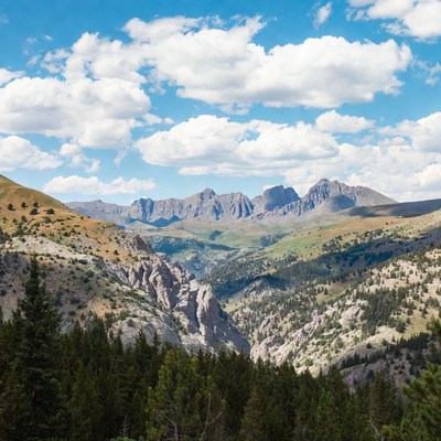 Mountains and valley under cloudy sky