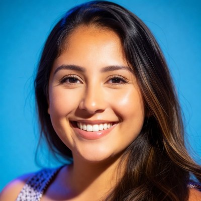 Woman smiles with blue background