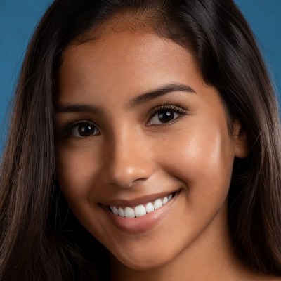 Smiling woman with long hair indoors