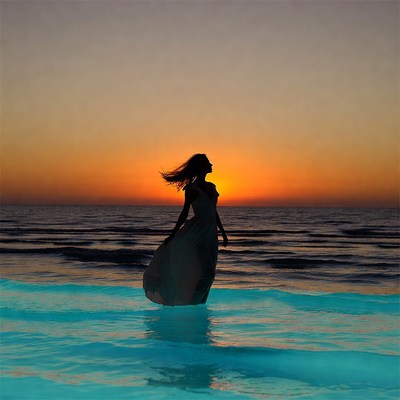Woman at ocean sunset