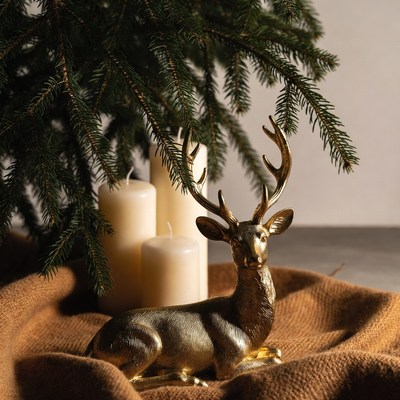 Decorative deer with candles and greenery