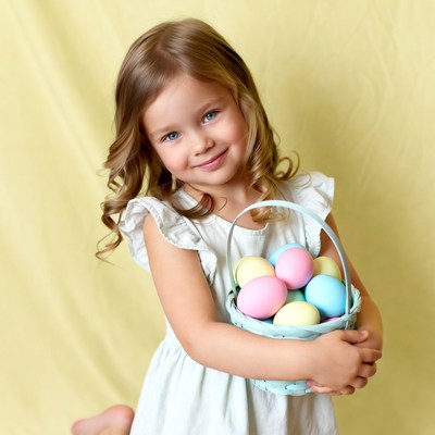 Girl with easter eggs in basket