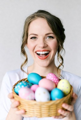 Woman holding easter eggs in basket