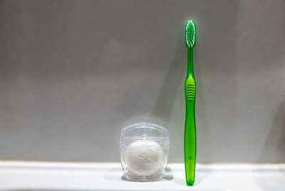 Toothbrush and dental supplies on counter