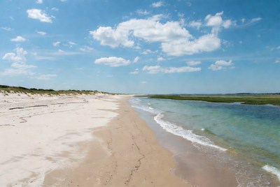 Empty beach with clear water and sand