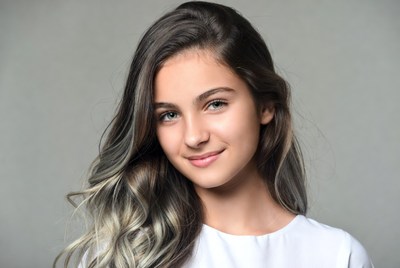Young girl with long hair smiling
