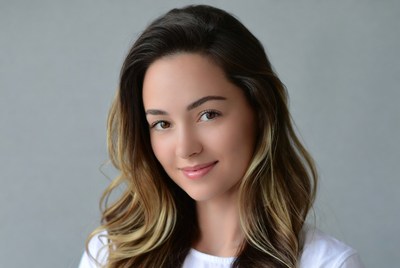 Young woman with long hair smiles