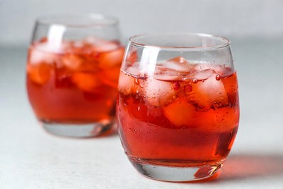 Refreshing drinks with ice in glasses