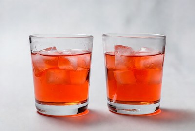 Red drinks in clear glasses with ice