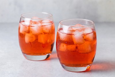 Refreshing drinks with ice cubes in glasses