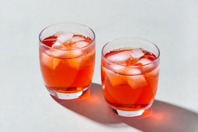 Two glasses of red drink with ice