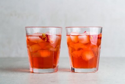 Colorful drinks with ice in glasses