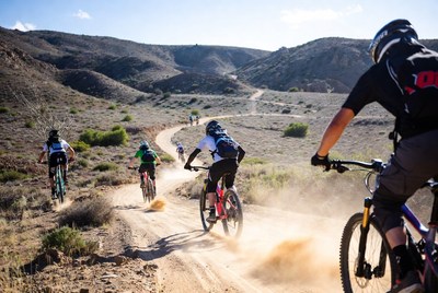 Bikers riding on a dusty trail