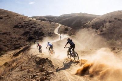 Mountain bikers on a dirt trail during daytime