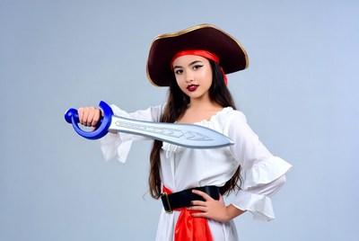 Woman dressed as a pirate holding a sword