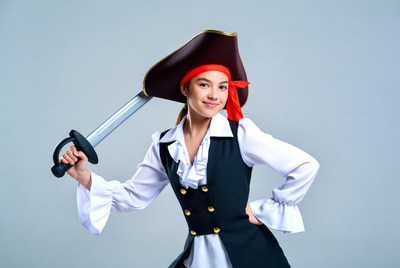 Pirate posing with sword in studio