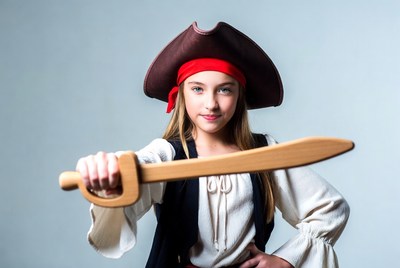Young pirate with wooden sword