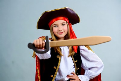 Girl in pirate costume holding sword
