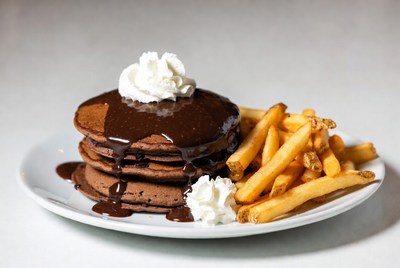 Chocolate pancakes with fries on plate