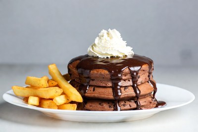 Chocolate pancakes with fries on a plate