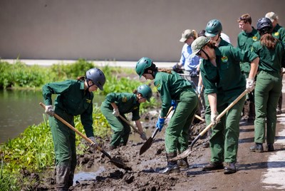 Community members work on wetland restoration