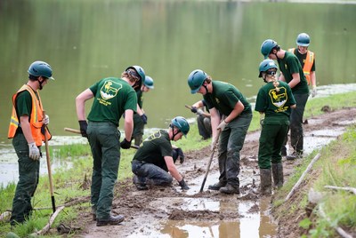 Volunteers work near water