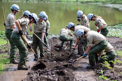 Volunteers work together to improve park site