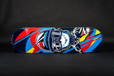 Colorful skateboard deck design with cartoon