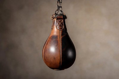 Vintage leather punching bag hanging