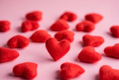 Red hearts on pink background