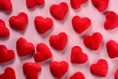 Red hearts on pink background