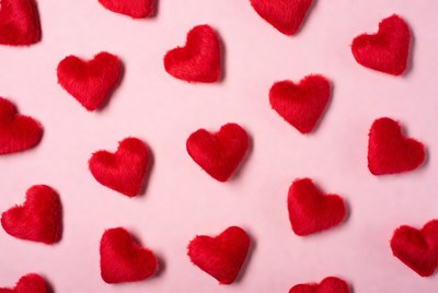 Red hearts on pink background display